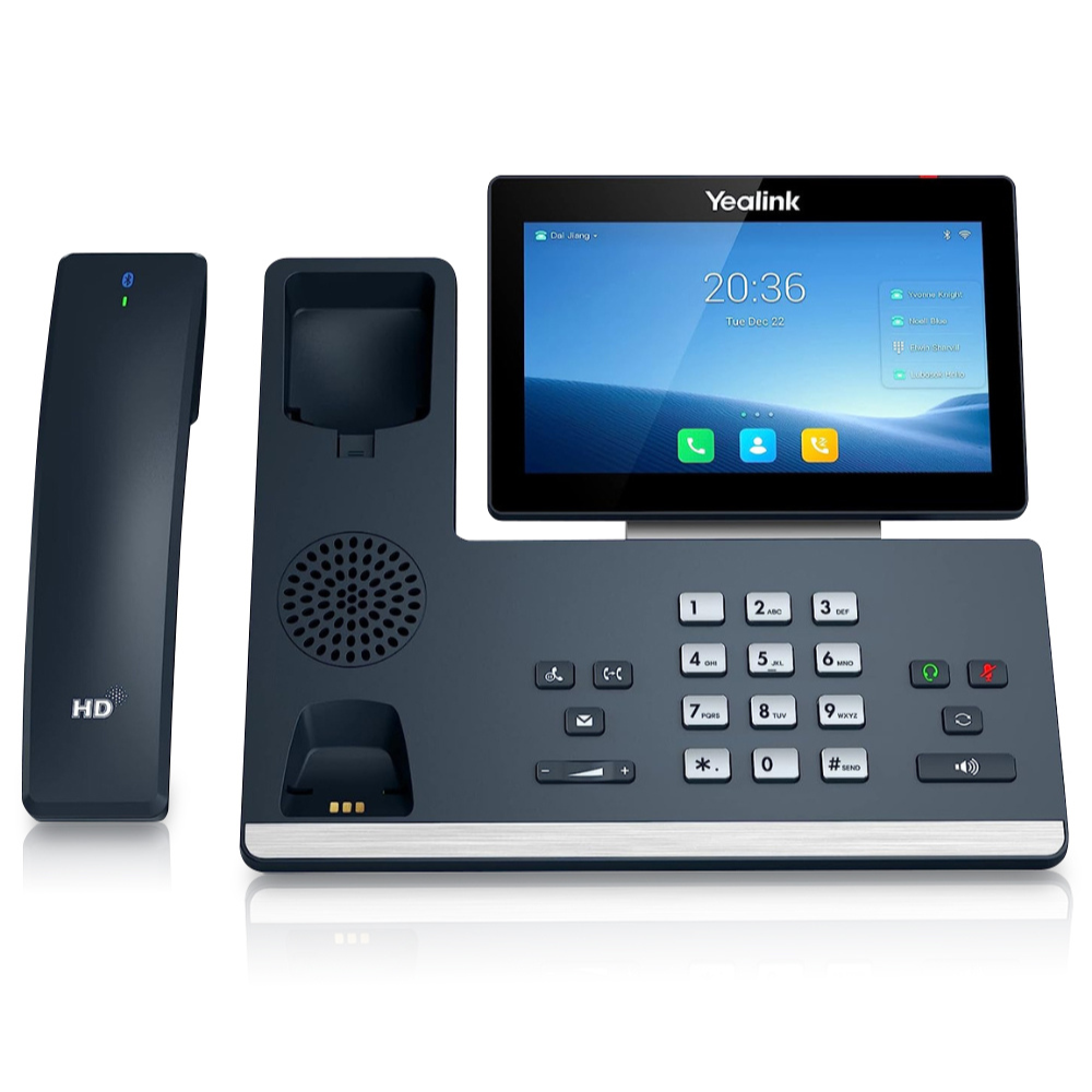 A black T58W Pro IP Phone is showcased from a frontal view on a white background. The phone boasts a 7-inch (1024 x 600) capacitive adjustable touch screen, providing a user-friendly interface. Alongside the phone, the cordless handset is positioned, adding mobility and convenience to your communication experience. The silver number buttons on the dashboard and other functionality buttons are clearly visible, ensuring effortless navigation and operation.